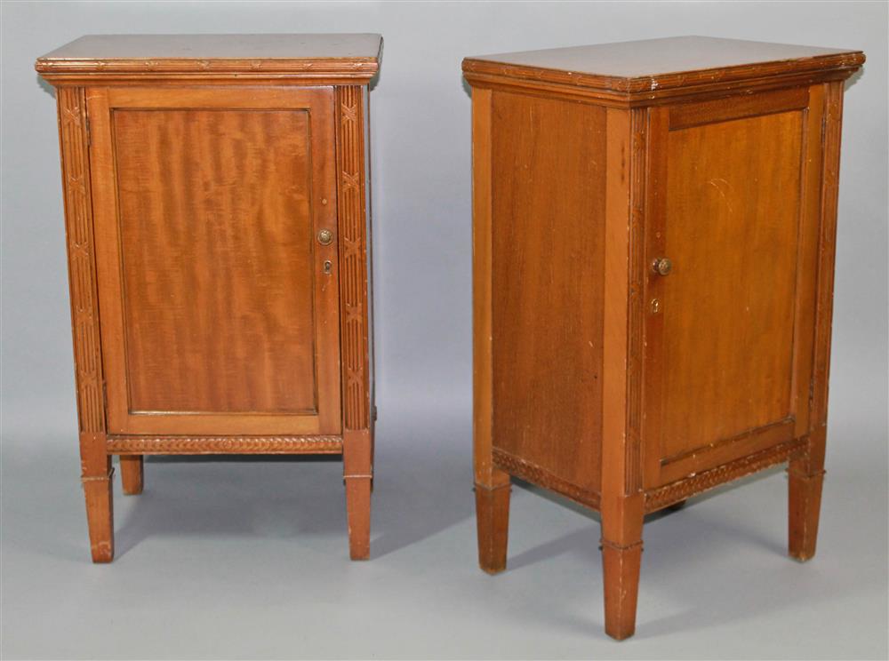 Appraisal: PAIR OF NEOCLASSICAL STYLE CARVED CHERRYWOOD CABINETS each having a