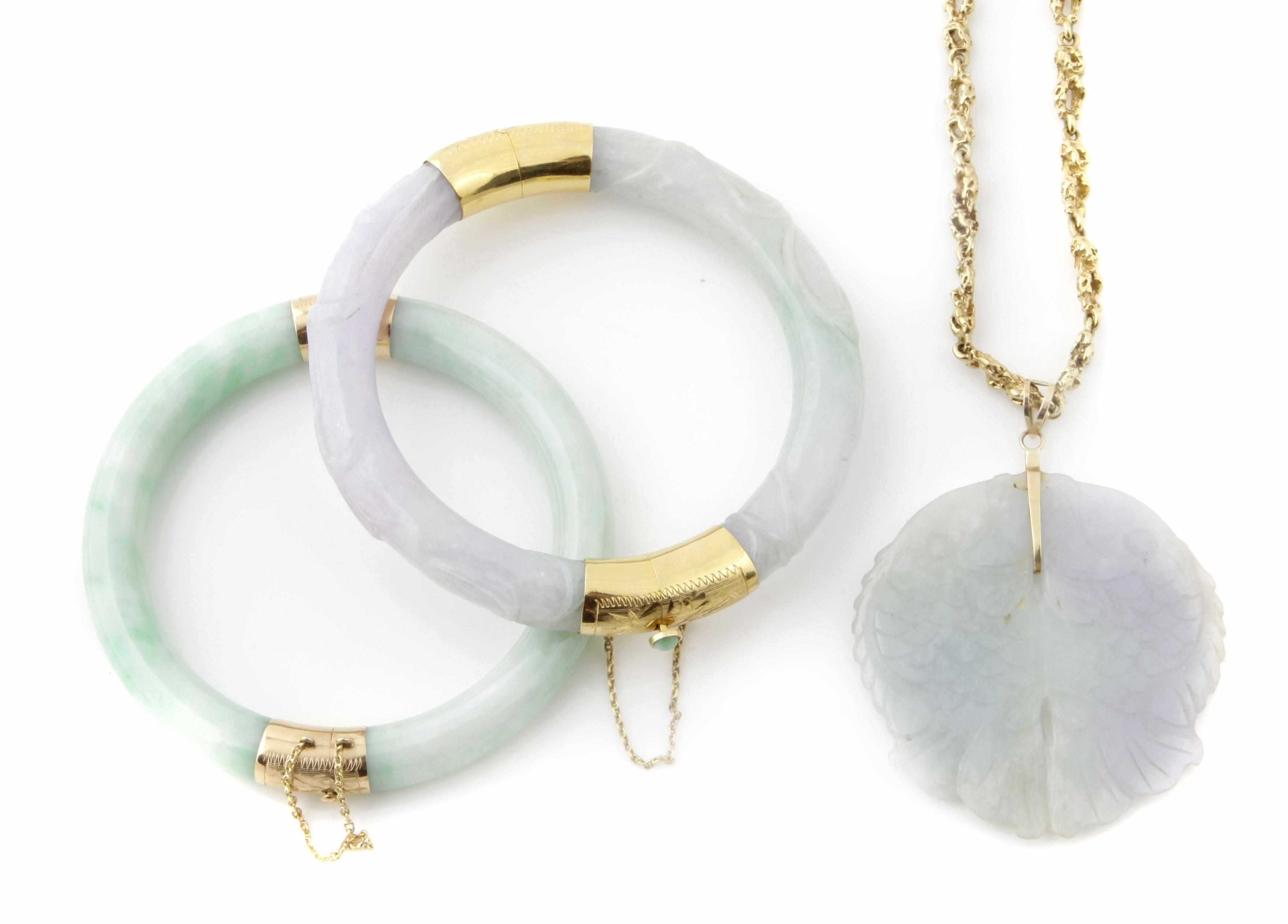 Appraisal: A collection of multi-colored jade and gold jewelry comprising bangles