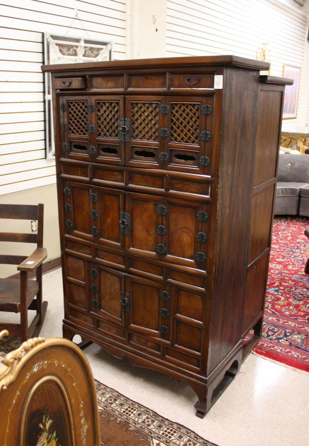 Appraisal: TALL KOREAN THREE-LEVEL CABINET having three sets of double doors