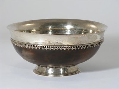 Appraisal: An Omar Ramsden silver and walnut Mazer bowl with flaring