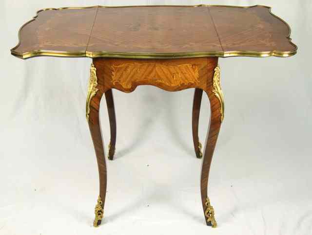 Appraisal: A Louis XV style Pembroke table circa the serpentine top