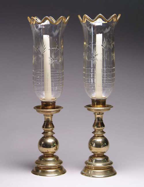 Appraisal: PAIR OF BRASS AND GLASS HURRICANE LAMPS Lamps are made