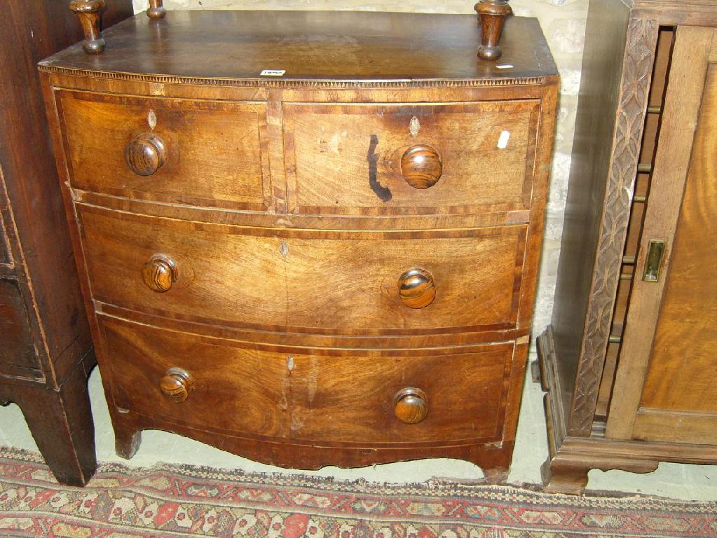 Appraisal: A small Georgian mahogany bow fronted chest of long and