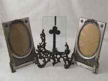 Appraisal: A pair of silver plated oval strut back photo frames