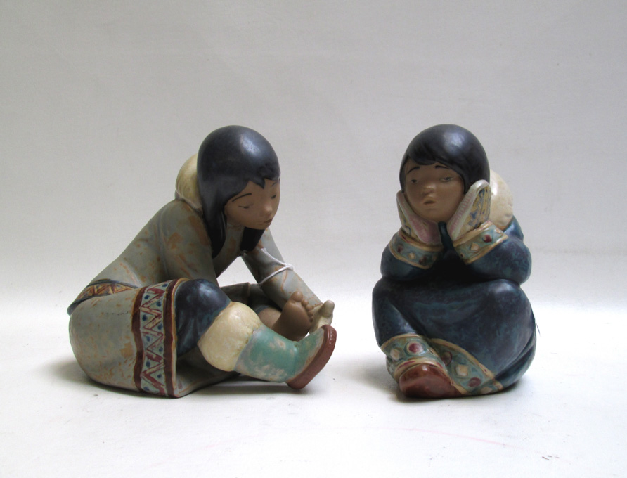 Appraisal: TWO LLADRO PORCELAIN ESKIMO FIGURINES both by sculptor Francisco Catala