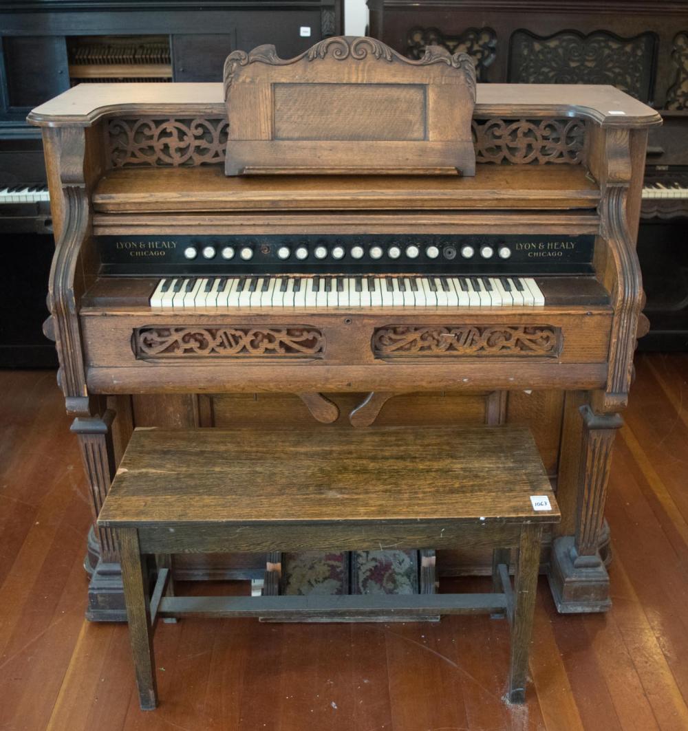 Appraisal: VICTORIAN OAK PARLOR PUMP ORGAN WITH BENCH Lyon Healy Co