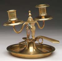 Appraisal: RARE RUSSIAN BRASS DOUBLE CHAMBERSTICK The interesting lighting piece has