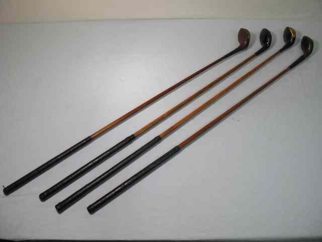 Appraisal: Fancy face wood shaft golf clubs total Includes a E