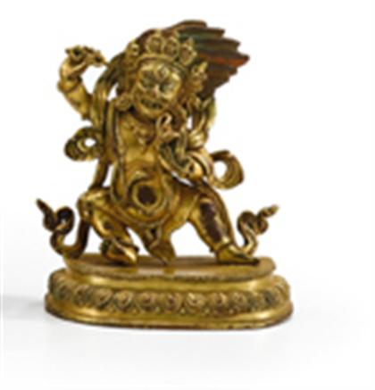 Appraisal: Sino-Tibetan gilt-bronze model of Vajrapani Well cast demonic figure standing