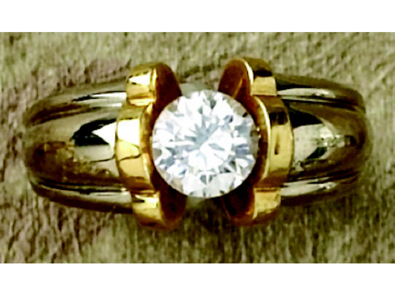 Appraisal: SOLITAIRE RING k two tone gold solitaire ring set with