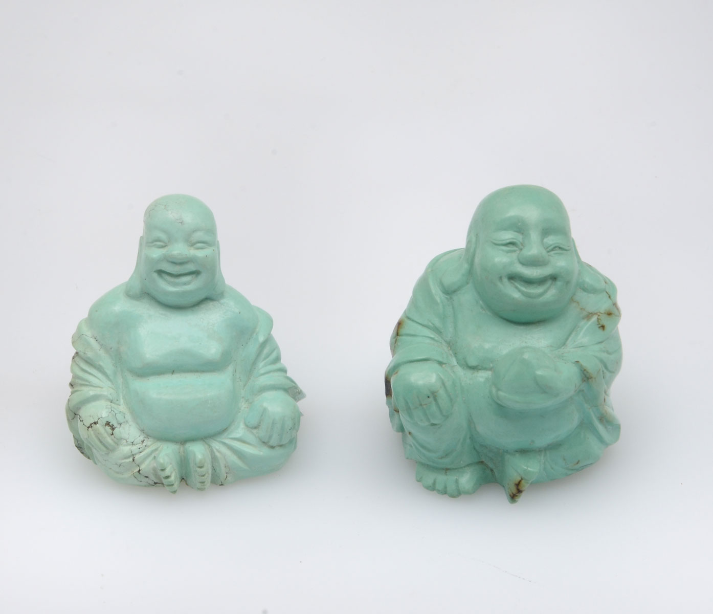 Appraisal: CHINESE CARVED TURQUOISE RESTING BUDDHA Comprising resting buddha and resting