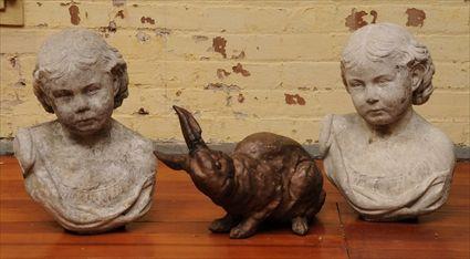 Appraisal: TWO CAST-STONE BUSTS OF CHILDREN Together with a composition figure