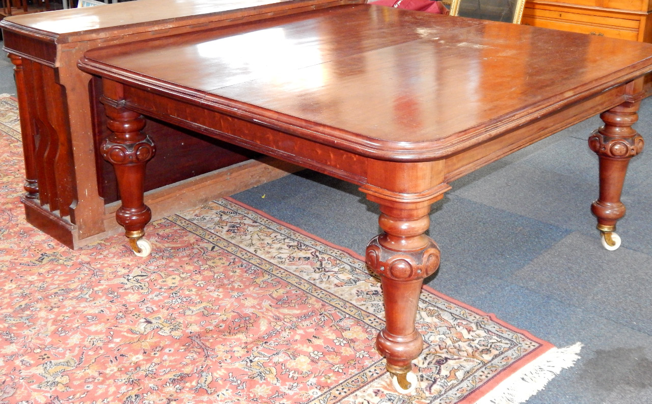 Appraisal: A Victorian mahogany wind out dining table with three and