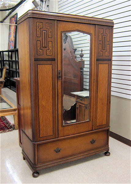 Appraisal: CARVED AND INLAID OAK WARDROBE English early th century centering