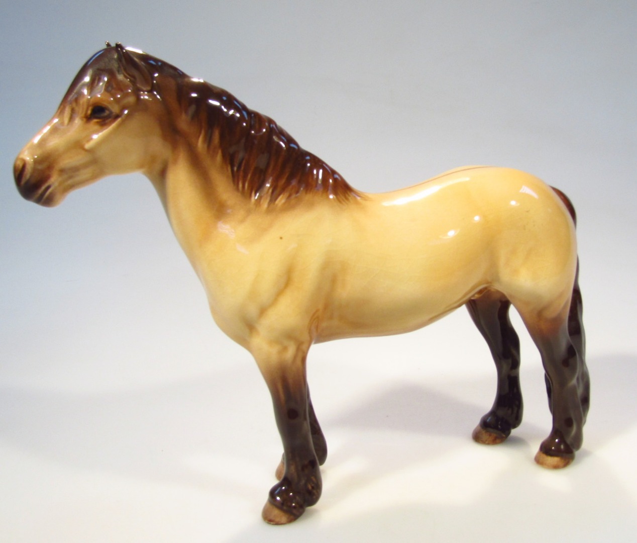 Appraisal: A Beswick horse Highland in brown and cream colourway standing