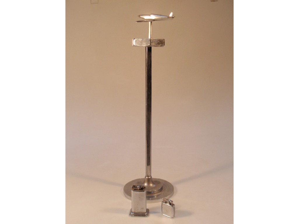 Appraisal: A chrome smokers stand the ashtray mounted with an aeroplane