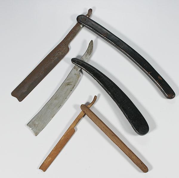 Appraisal: THREE FOLK ART STRAIGHT RAZORS includes two wooden folding razors