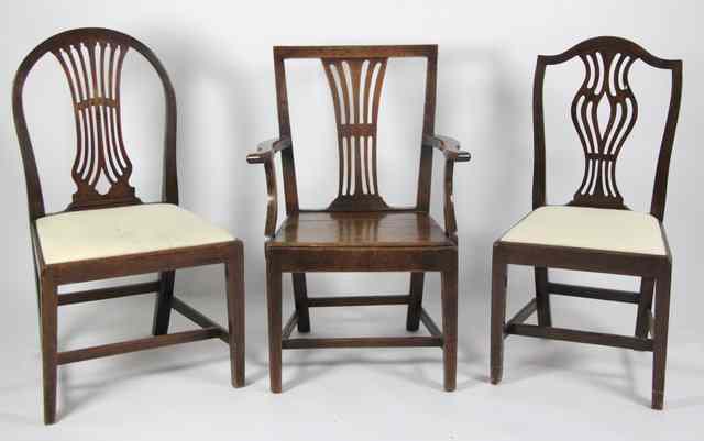 Appraisal: An oak armchair with pierced splat and two other dining