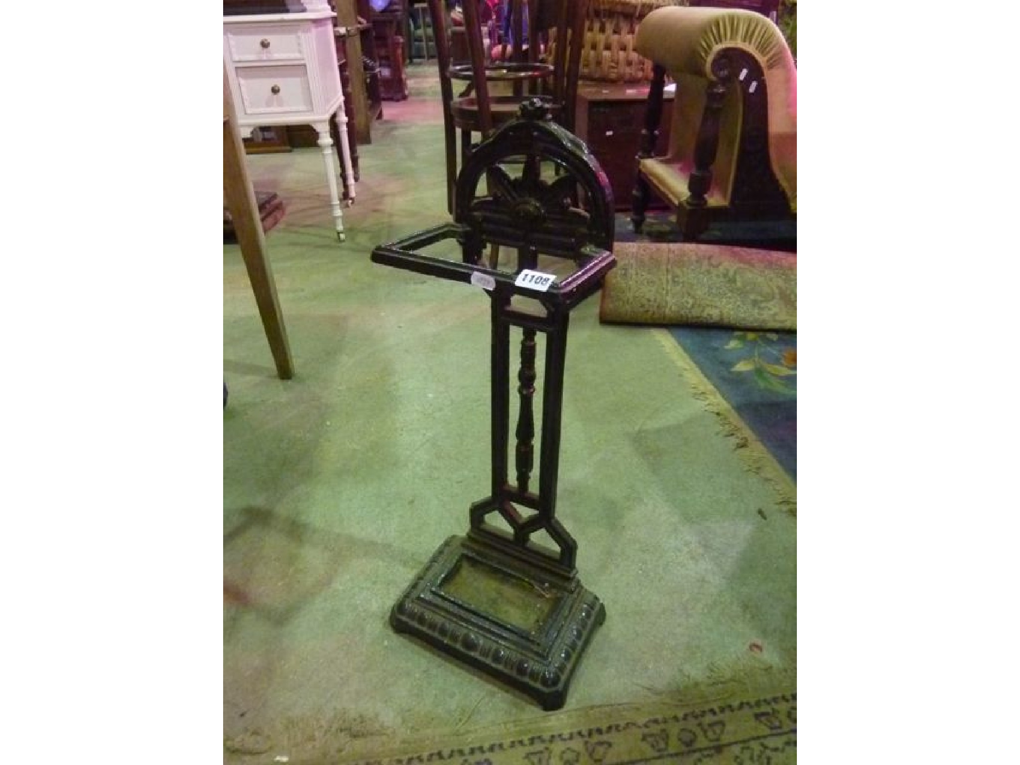 Appraisal: A small painted cast iron umbrella stickstand with geometric foliate