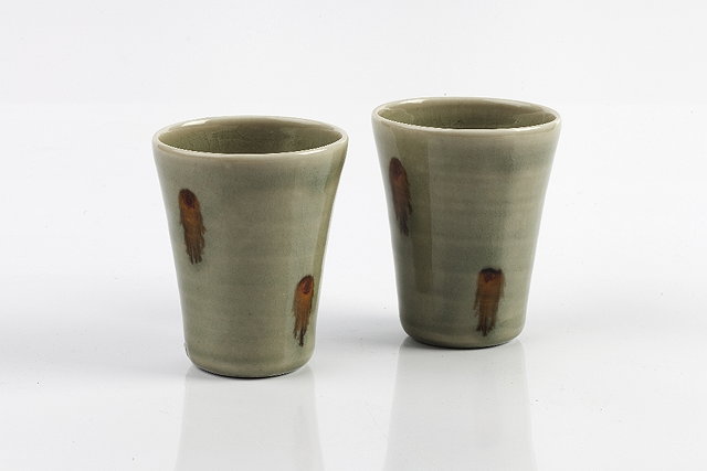 Appraisal: Edward Hughes British - Pair of beakersporcelain with celadon glaze