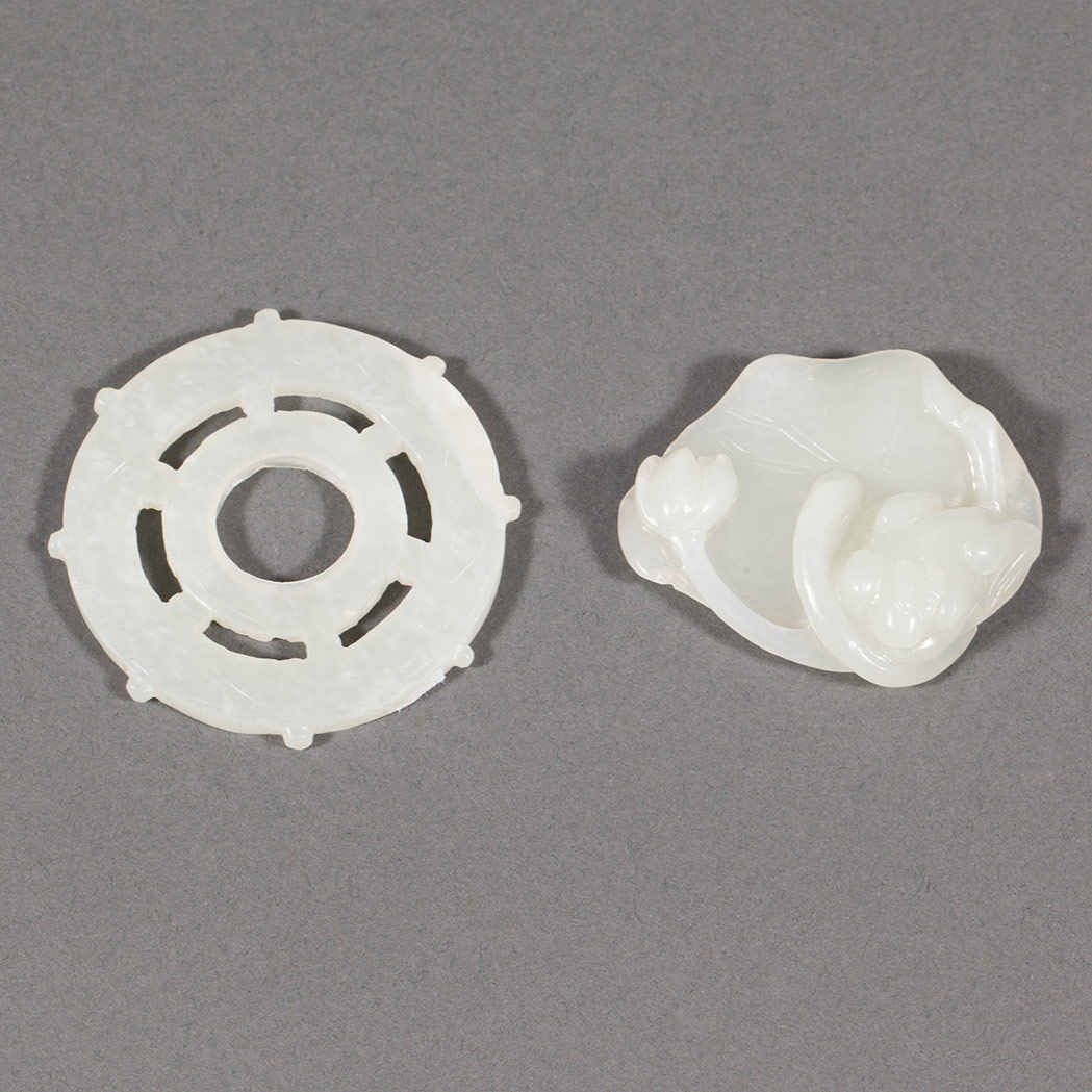 Appraisal: Two Chinese White Jade Pendants Comprising a ship wheel and