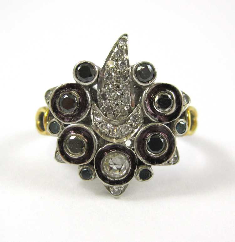 Appraisal: DIAMOND SILVER AND YELLOW GOLD RING The sterling silver and