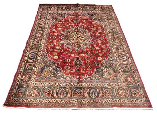 Appraisal: RUG Semi-Antique Persian Mashad carpet garnet ground elaborate floral medallion