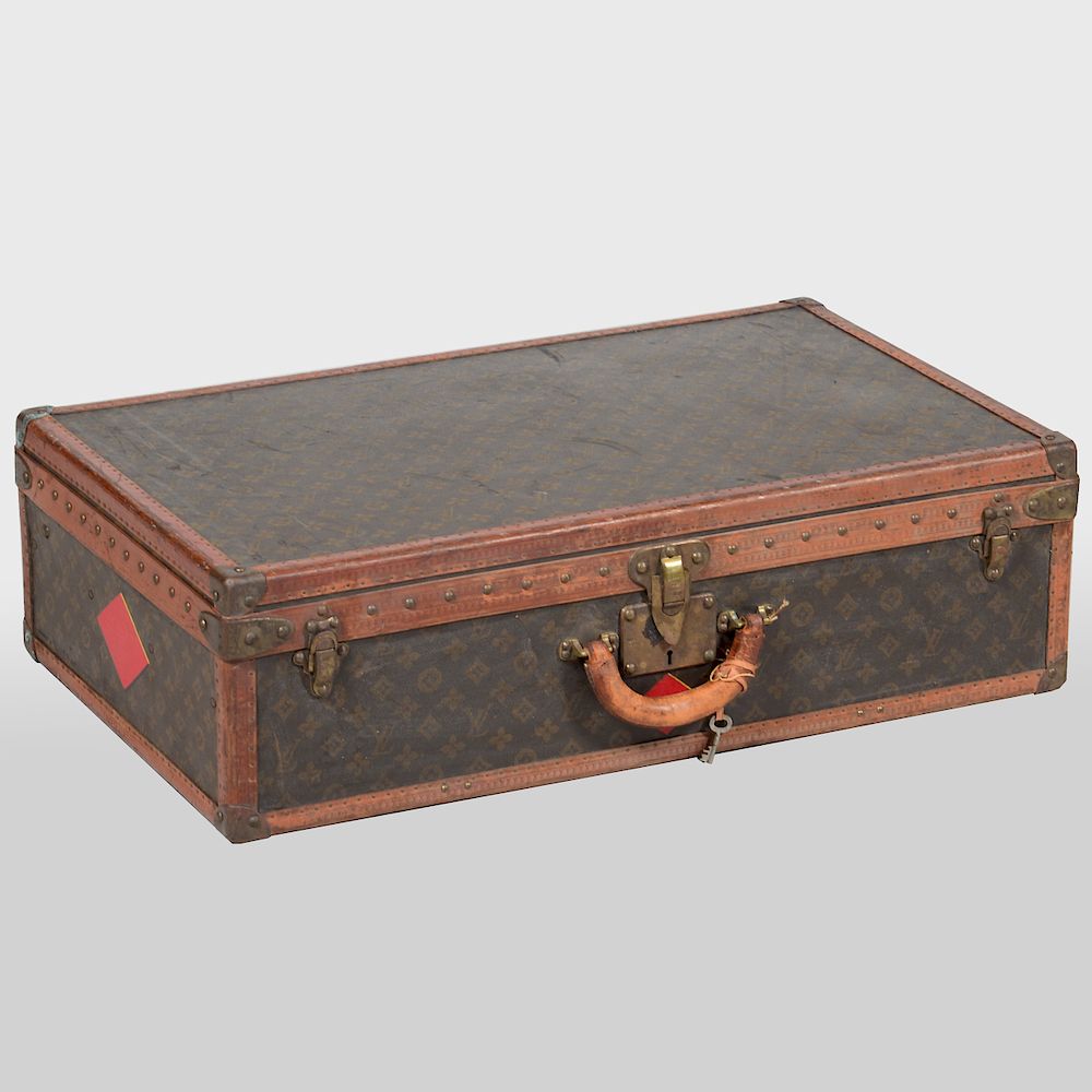 Appraisal: Louis Vuitton Suitcase The brass hasp stamped Louis Vuitton and