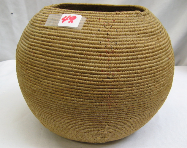 Appraisal: AN ALASKAN ESKIMO INDIAN BASKET coiled of beach grass Height