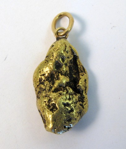 Appraisal: FOURTEEN KARAT GOLD PENDANT The gold nugget pendant weighs grams