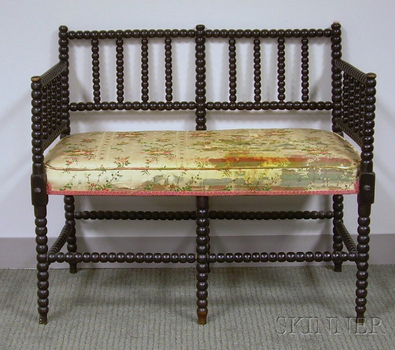 Appraisal: Victorian Ebonized Spool-turned Settee with Upholstered Seat lg in