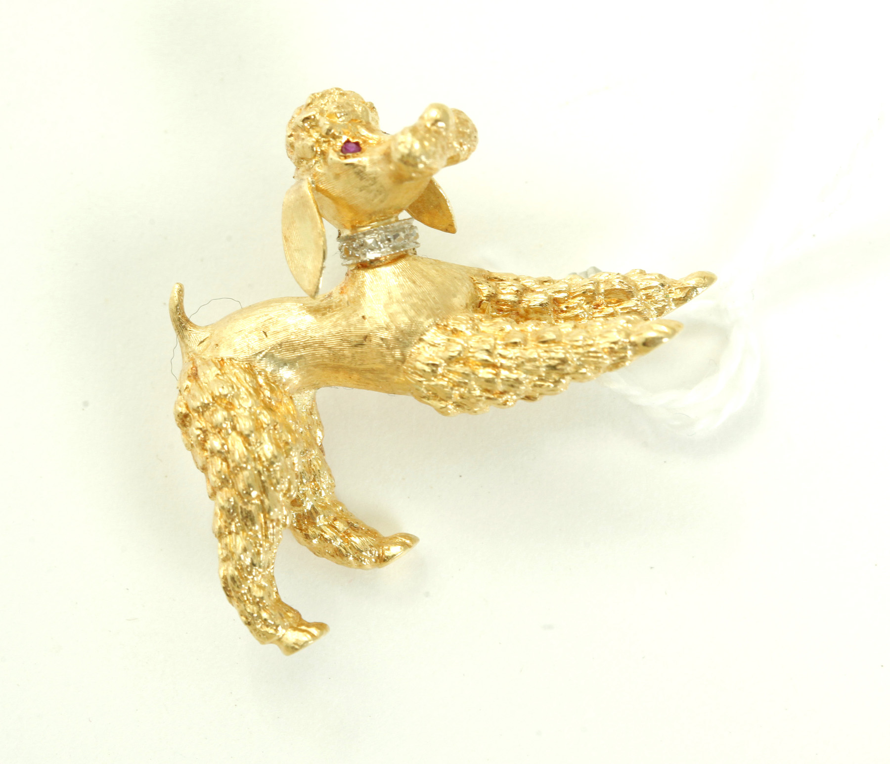 Appraisal: GOLD POODLE BROOCH European th century k yellow gold with