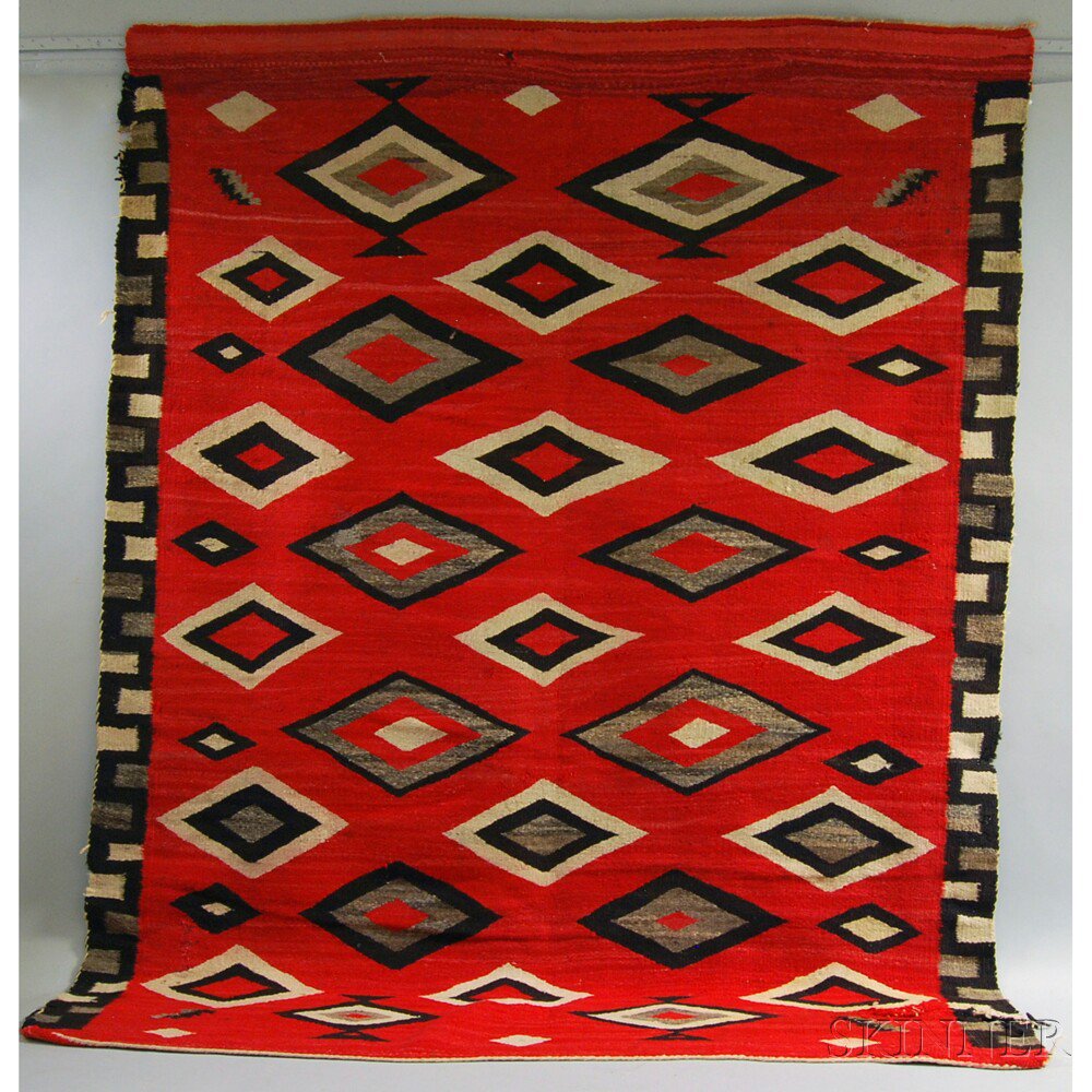 Appraisal: Navajo Rug with a Greek key border and graduating diamonds