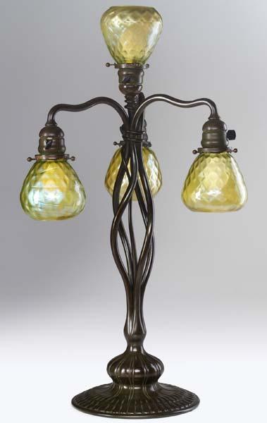 Appraisal: TIFFANY STUDIOS Tall four-light lamp with twisted vine-like stems in