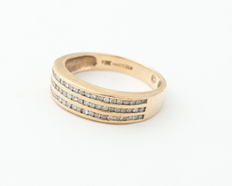 Appraisal: KARAT YELLOW GOLD AND DIAMOND BAND MAGICGLO Three narrow channels