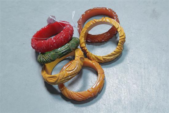 Appraisal: SIX BAKELITE BRACELETS All bangles all deeply carved with floral