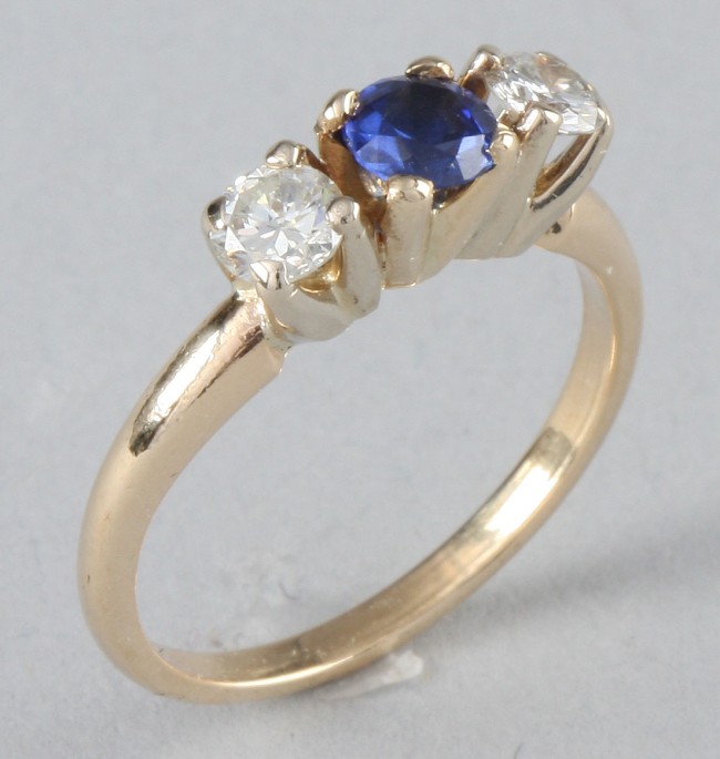 Appraisal: KY diamond ring with one mm sapphire and two mm