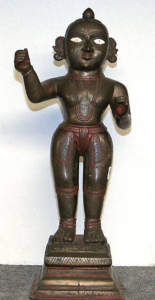 Appraisal: A painted brass Hindu deity with separately cast base Possibly