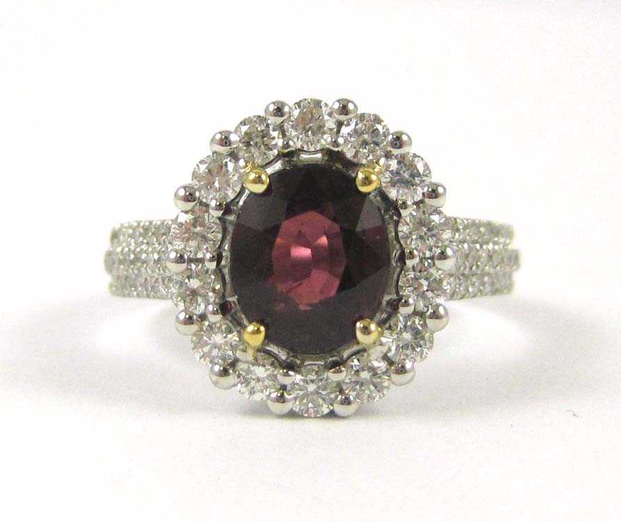 Appraisal: RHODOLITE GARNET AND DIAMOND RING The k white and yellow