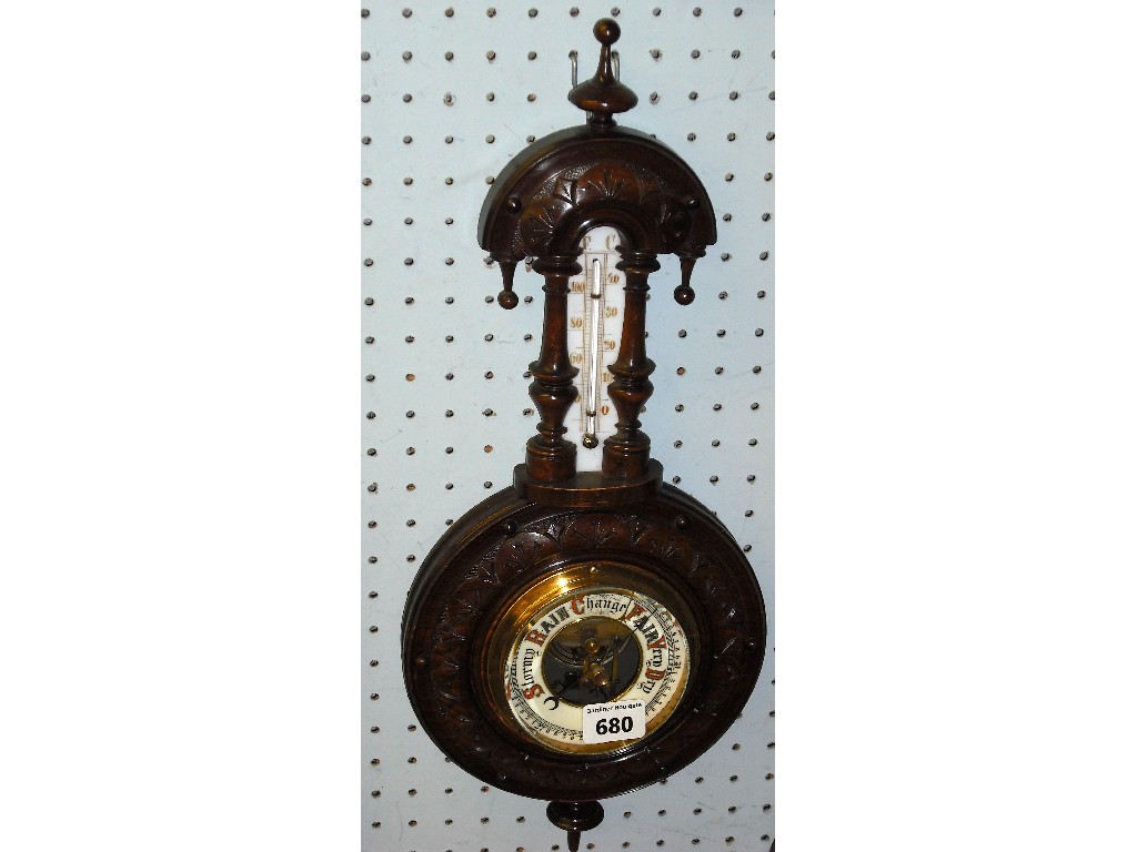 Appraisal: Mahogany aneroid barometer thermometer the cream dial within a carved