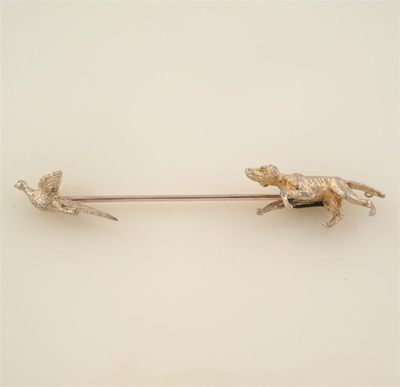 Appraisal: A gold stick pin formed as a dog and cock