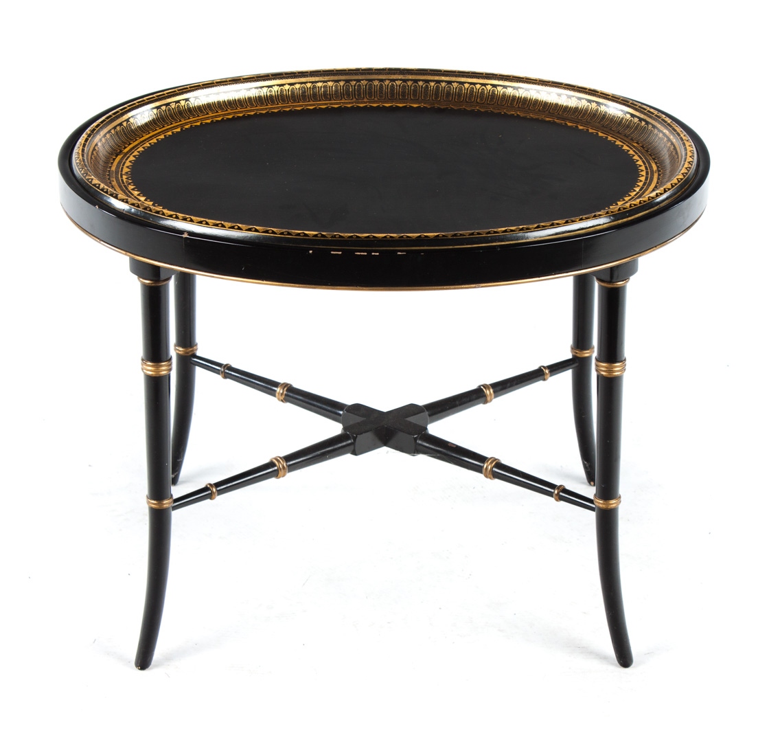 Appraisal: Regency style ebonized wood coffee table th century oval tray