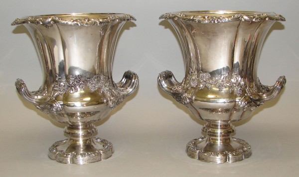 Appraisal: Pair of urns featuring grape and vine motif double handles