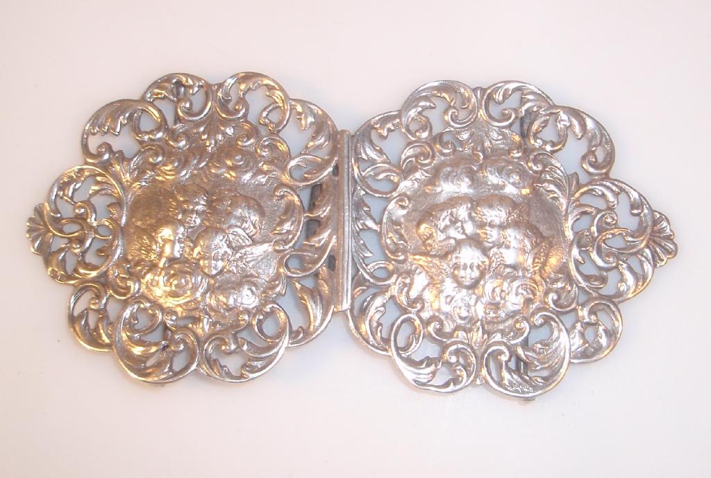 Appraisal: A Victorian cast silver nurses buckle of rococo scrolling form