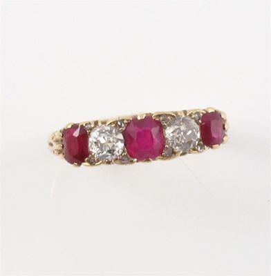 Appraisal: A ruby and diamond half hoop ring Set with three