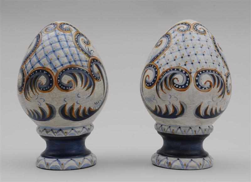 Appraisal: PAIR OF PAINTED TERRACOTTA LOTUS BUD FINIALS Each of pointed