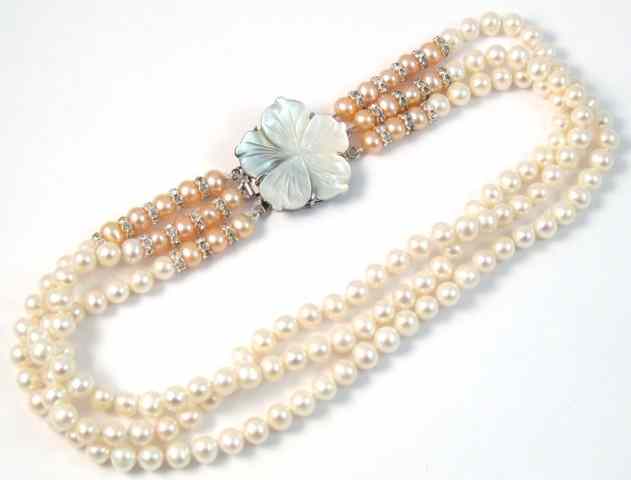 Appraisal: THREE ARTICLES OF PEARL JEWELRY including a pair of white