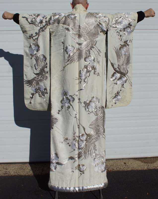 Appraisal: Japanese Wedding Kimono extensively embroidered with silver thread decorated with