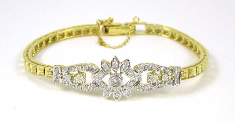 Appraisal: DIAMOND AND FOURTEEN KARAT GOLD BRACELET with yellow gold safety