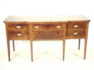 Appraisal: A Regency mahogany breakfront sideboard circa the rounded top above